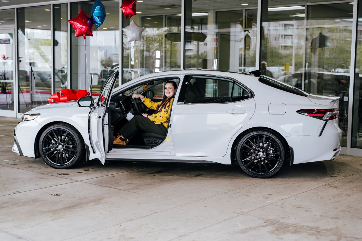 Christina Sheets sits inside her new Toyota