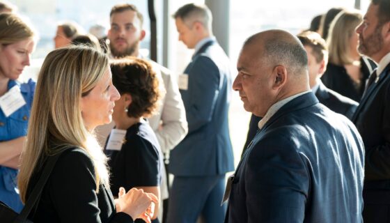 Business leaders talking at a networking reception