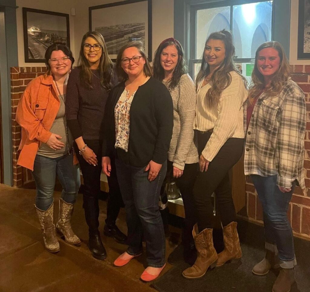 Group of military spouses stand for a photo